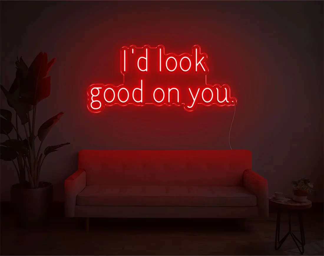 I’d Look Good On You” Valentine’s Day LED neon sign glowing in playful pink and red tones, perfect for romantic décor by Neon.Shop