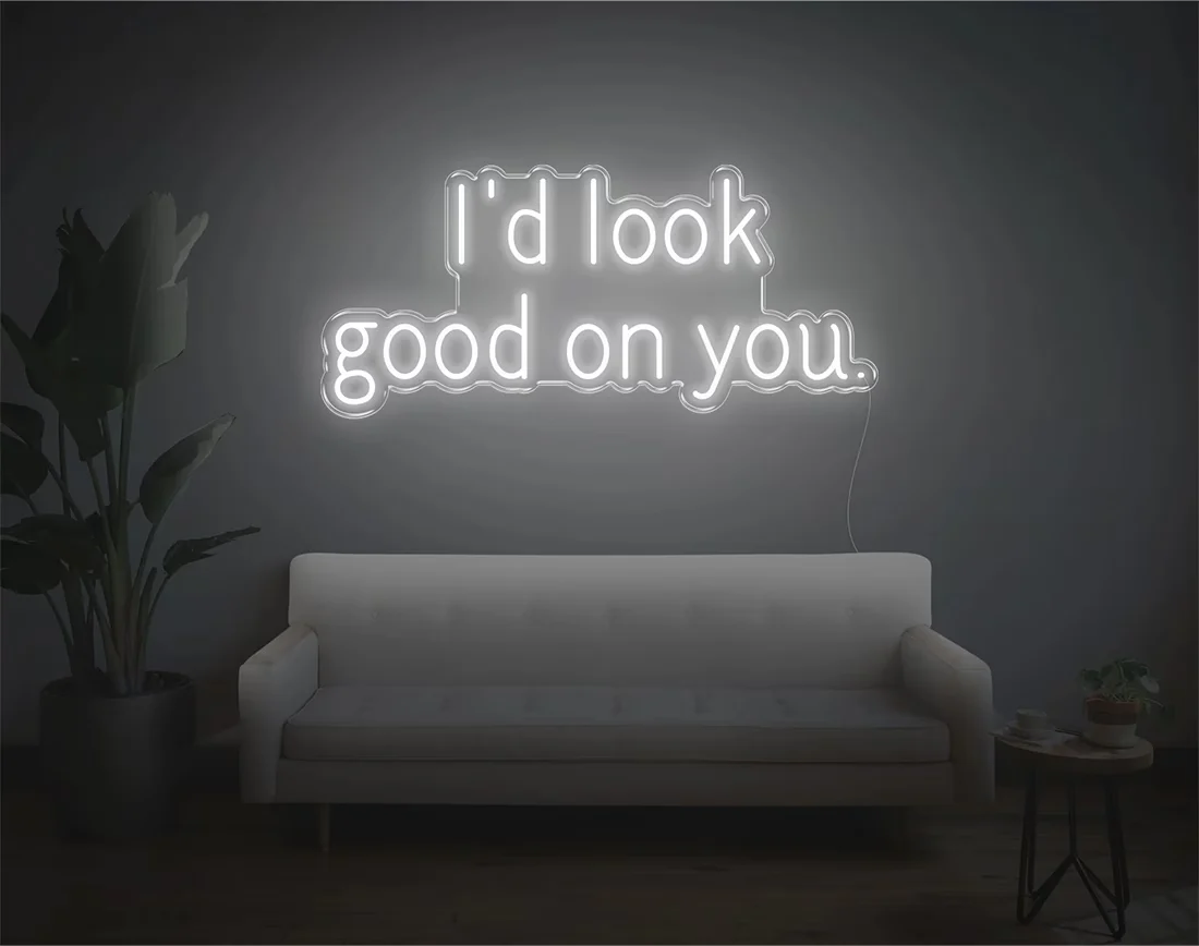 I’d Look Good On You” Valentine’s Day LED neon sign glowing in playful pink and red tones, perfect for romantic décor by Neon.Shop