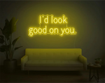 I’d Look Good On You” Valentine’s Day LED neon sign glowing in playful pink and red tones, perfect for romantic décor by Neon.Shop