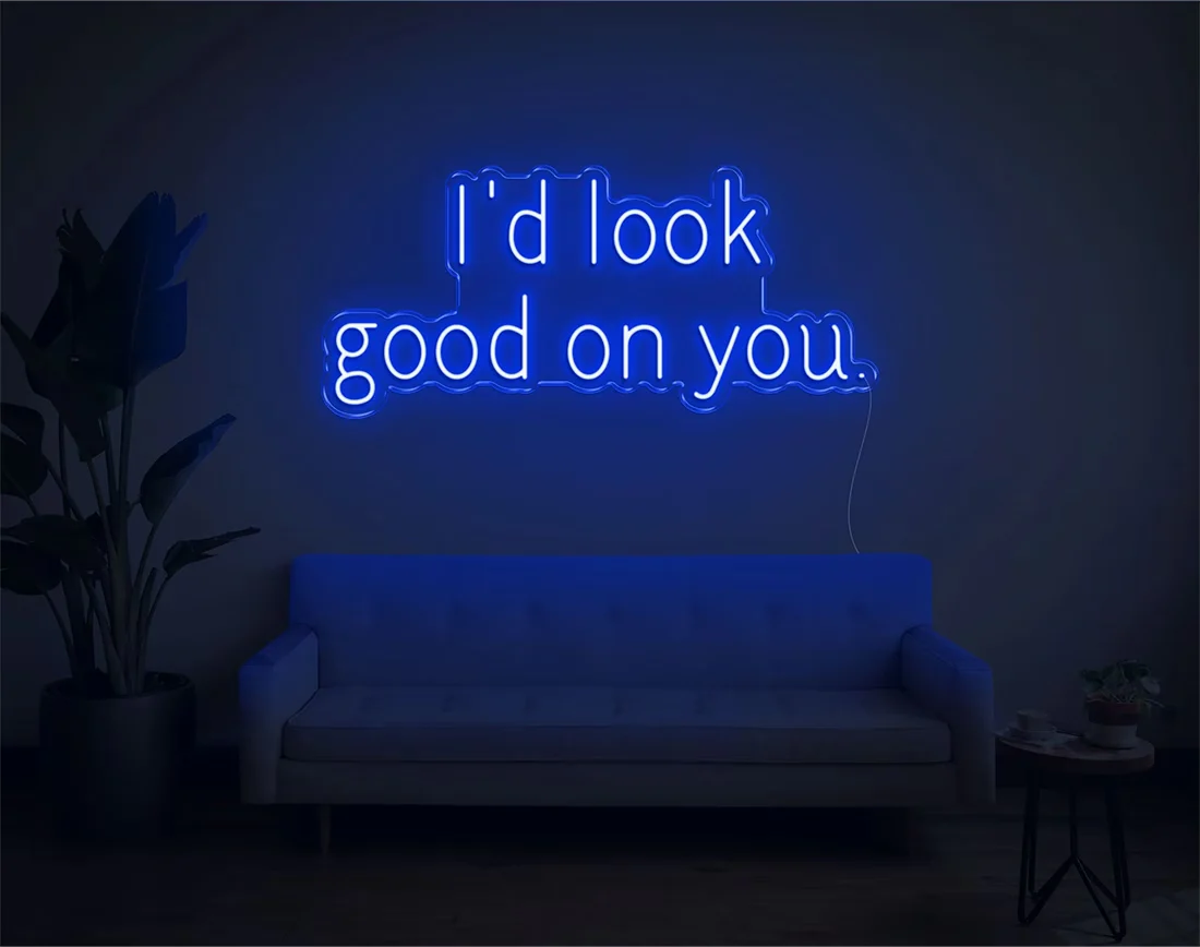 I’d Look Good On You” Valentine’s Day LED neon sign glowing in playful pink and red tones, perfect for romantic décor by Neon.Shop