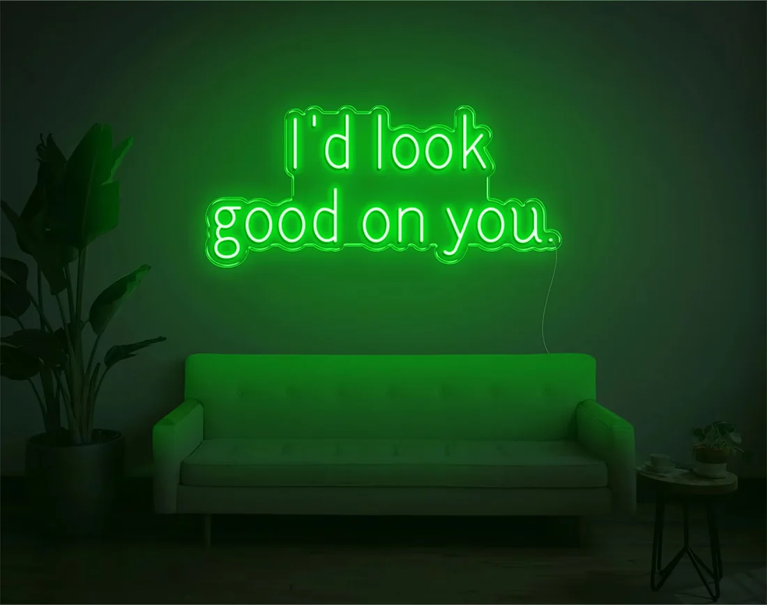 I’d Look Good On You” Valentine’s Day LED neon sign glowing in playful pink and red tones, perfect for romantic décor by Neon.Shop