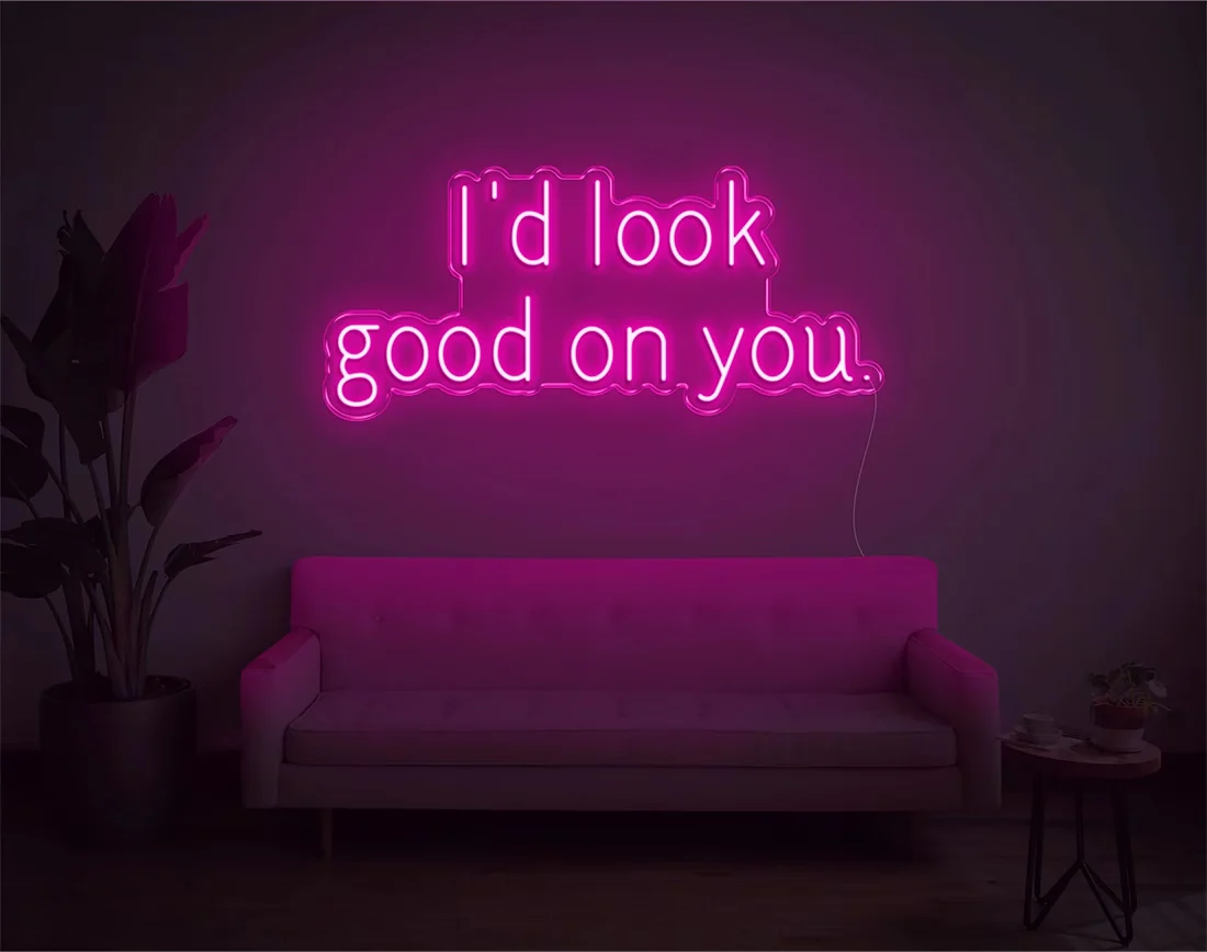 I’d Look Good On You” Valentine’s Day LED neon sign glowing in playful pink and red tones, perfect for romantic décor by Neon.Shop