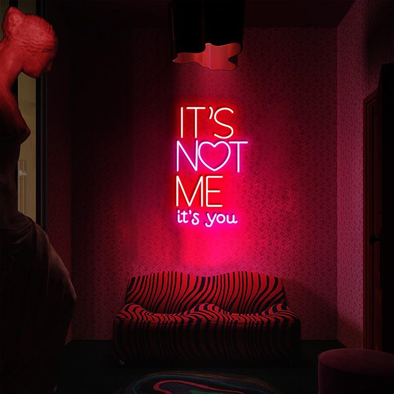 It’s Not Me It’s You neon sign displayed in bar or party setup by Neon.Shop