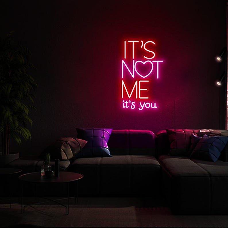 It’s Not Me It’s You neon sign displayed in bar or party setup by Neon.Shop