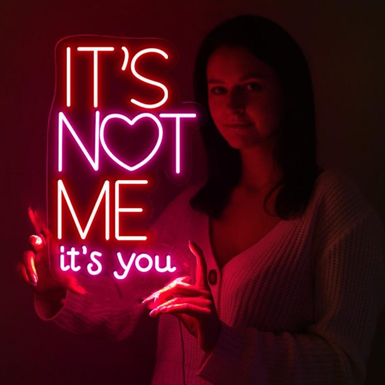 It’s Not Me It’s You neon sign displayed in bar or party setup by Neon.Shop
