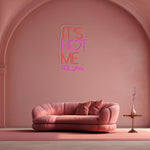 It’s Not Me It’s You neon sign displayed in bar or party setup by Neon.Shop