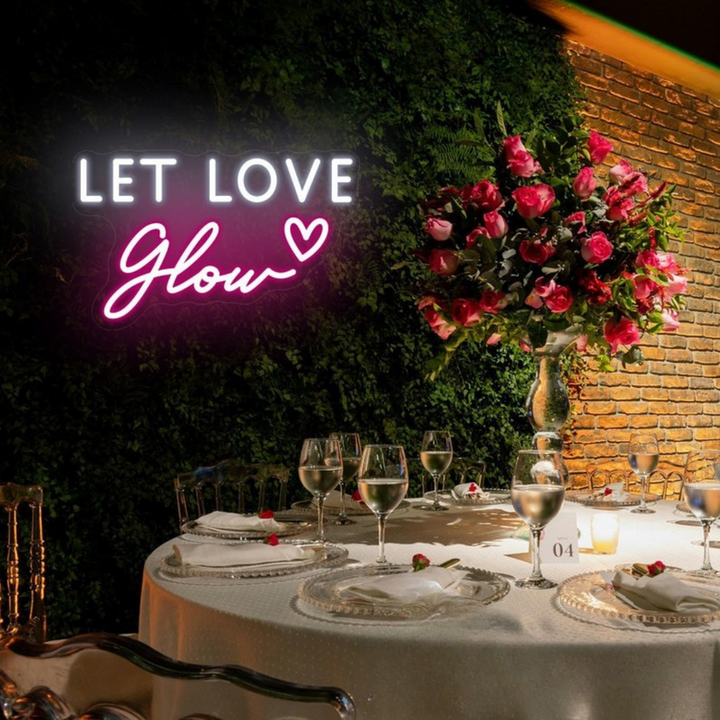 Let Love Glow Wedding LED Neon Sign glowing at reception by Neon.Shop