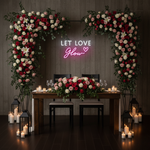 Let Love Glow Wedding LED Neon Sign glowing at reception by Neon.Shop