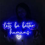 Let’s Be Better Humans neon sign glowing in bright LED colors by Neon.Shop 