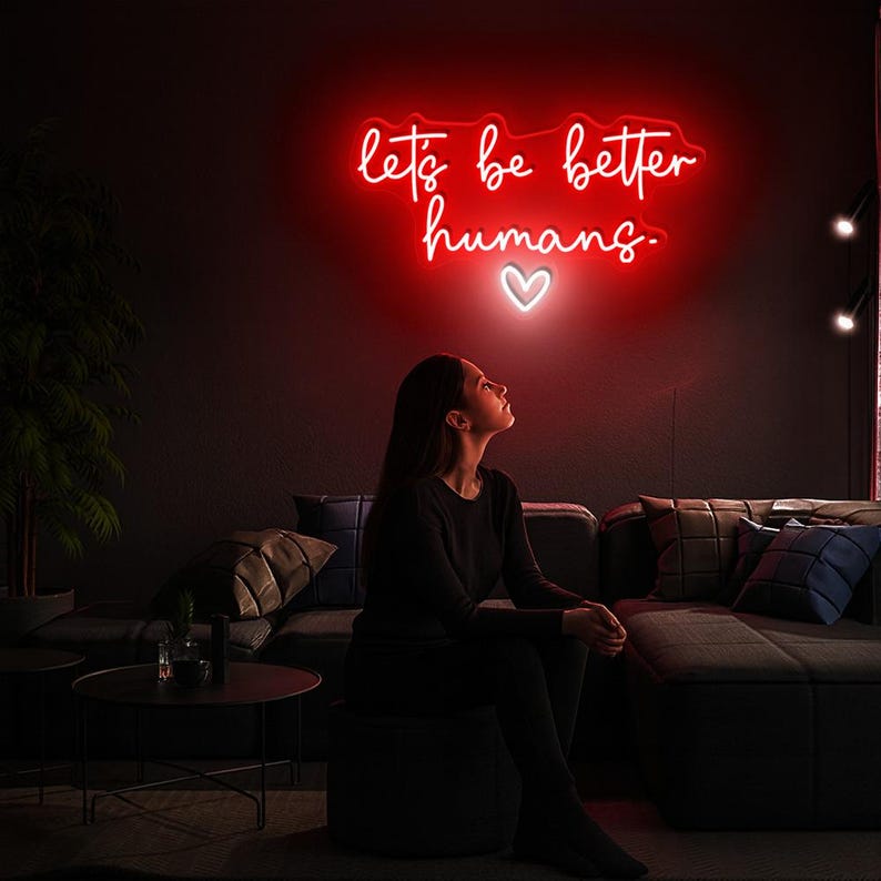 Let’s Be Better Humans neon sign glowing in bright LED colors by Neon.Shop