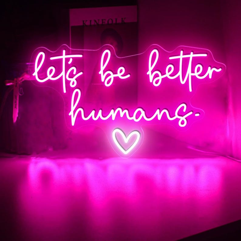Let’s Be Better Humans neon sign glowing in bright LED colors by Neon.Shop