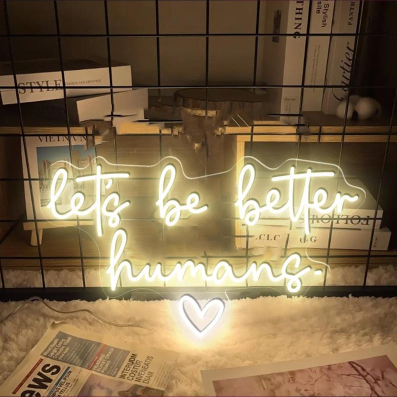 Let’s Be Better Humans neon sign glowing in bright LED colors by Neon.Shop