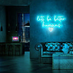 Let’s Be Better Humans neon sign glowing in bright LED colors by Neon.Shop