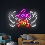 Love Dove Rings Valentine’s Day Neon Sign glowing on wall for romantic décor by Neon.Shop