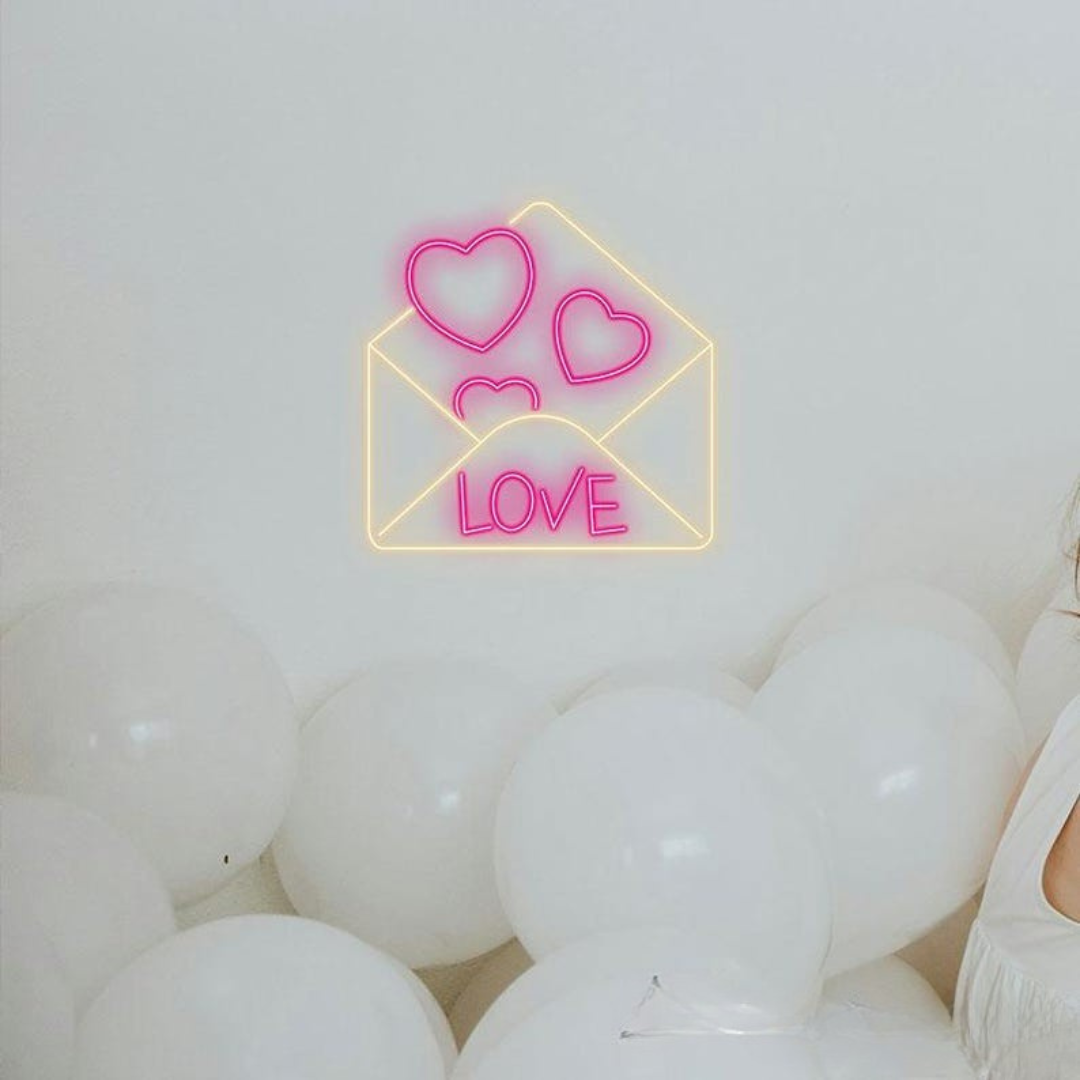 Love Envelope Valentine’s Day Neon Sign glowing on wall for romantic décor by Neon.Shop