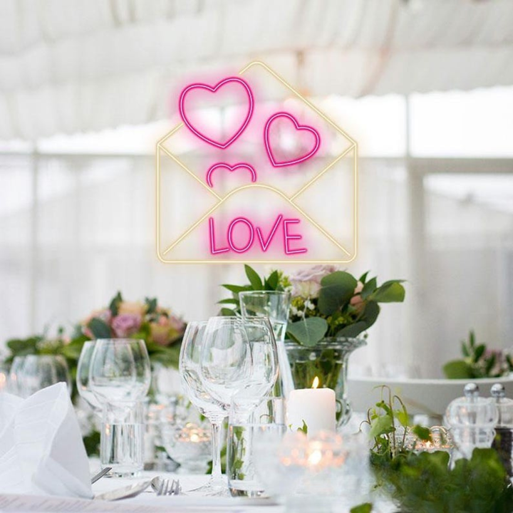 Love Envelope Valentine’s Day Neon Sign glowing on wall for romantic décor by Neon.Shop