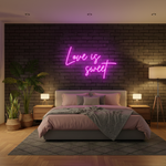 Love Is Sweet Valentine’s Day neon sign glowing in warm LED lights, romantic wall décor by Neon.Shop