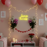 Love On The Rocks Valentine’s Day LED neon sign glowing in bold romantic tones, perfect for bedroom décor, home bars, Valentine’s gifts, and playful love-themed spaces by Neon.Shop.
