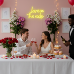 Love On The Rocks Valentine’s Day LED neon sign glowing in bold romantic tones, perfect for bedroom décor, home bars, Valentine’s gifts, and playful love-themed spaces by Neon.Shop.