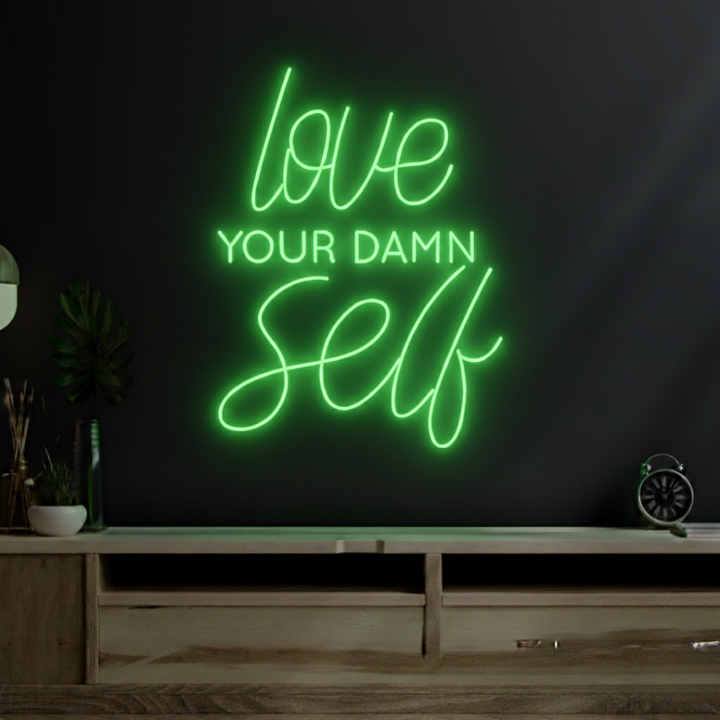 Love Your Damn Self LED neon sign by Neon.Shop glowing on a modern wall as bold and inspirational neon décor