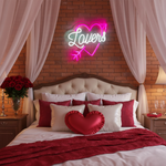 Lovers with arrow inside the heart Valentine’s Day LED neon sign glowing in romantic pink tones by Neon.Shop