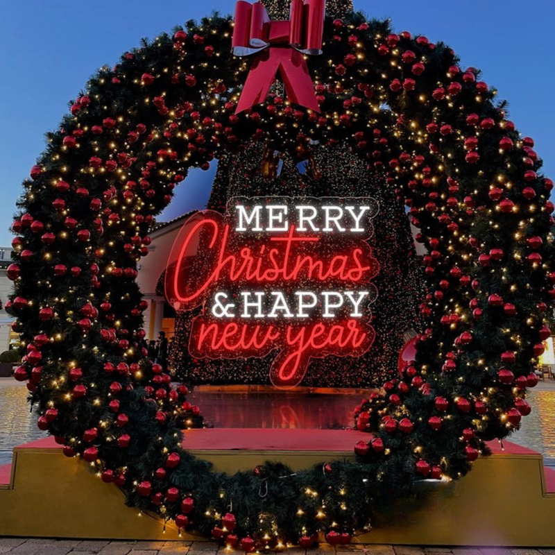 'Merry Christmas & Happy New Year' LED neon sign in a festive dual-color script by Neon.Shop.