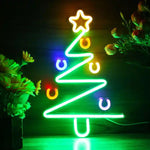 Modern Tree Merry Christmas Neon Sign by Neon.Shop glowing in warm LED light with sleek tree design and festive lettering.