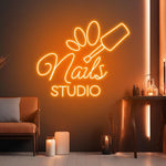 Nails Studio neon sign by Neon.Shop illuminating a beauty studio storefront