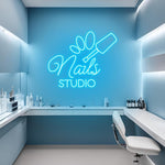 Nails Studio neon sign by Neon.Shop illuminating a beauty studio storefront