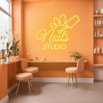 Nails Studio neon sign by Neon.Shop illuminating a beauty studio storefront