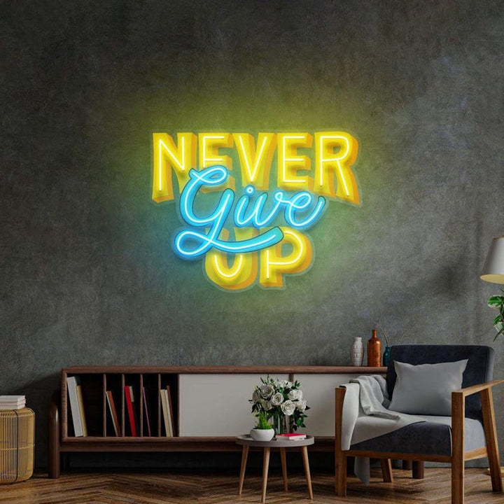 Never Give Up UV Art LED neon sign with bold motivational design glowing in vibrant colors by Neon.Shop