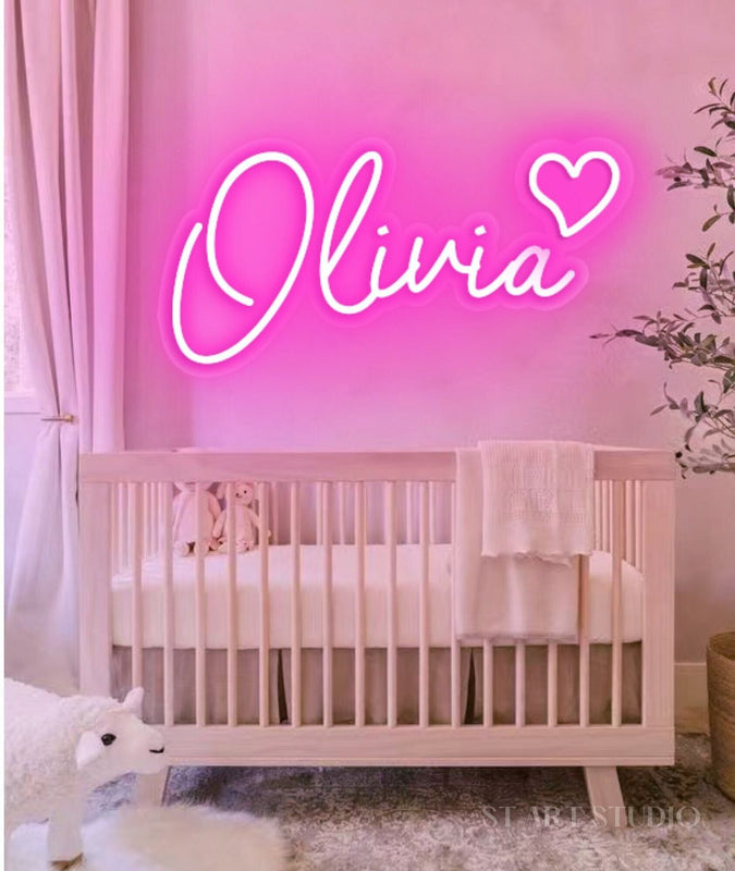 OLIVIA LED Neon Name Sign by Neon.Shop adding vibrant LED glow to bedrooms, home offices, and living spaces.
