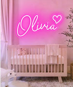 OLIVIA LED Neon Name Sign by Neon.Shop adding vibrant LED glow to bedrooms, home offices, and living spaces.