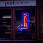 Open Arrow Business Neon Sign by Neon.Shop pointing toward a shop entrance