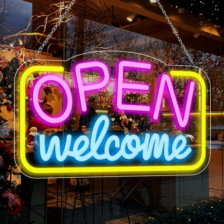 Open Welcome Business Neon Sign by Neon.Shop glowing in a storefront window