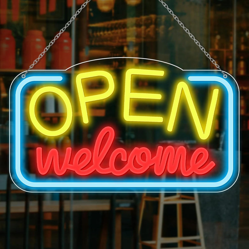 Open Welcome Business Neon Sign by Neon.Shop glowing in a storefront window