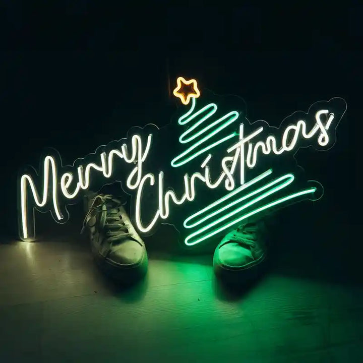 Pine Tree Merry Christmas Neon Sign by Neon.Shop featuring glowing pine tree design with festive lettering.
