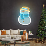 Plump Snowman Merry Christmas Neon Sign glowing in festive LED colors by Neon.Shop