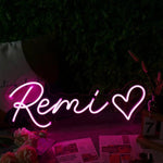 Remi Name LED Neon Sign in customizable LED tubing, personalized wall-mounted name light décor by Neon.Shop for bedrooms, events, and gifts.