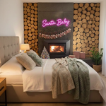 Santa Baby Merry Christmas Neon Sign by Neon.Shop glowing in LED light with playful holiday lettering design.