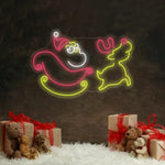 Santa Claus and Christmas Deer Merry Christmas LED neon sign glowing in festive colors by Neon.Shop.