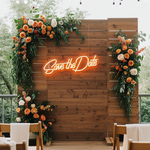 Save The Date wedding LED neon sign glowing on engagement backdrop – Neon.Shop