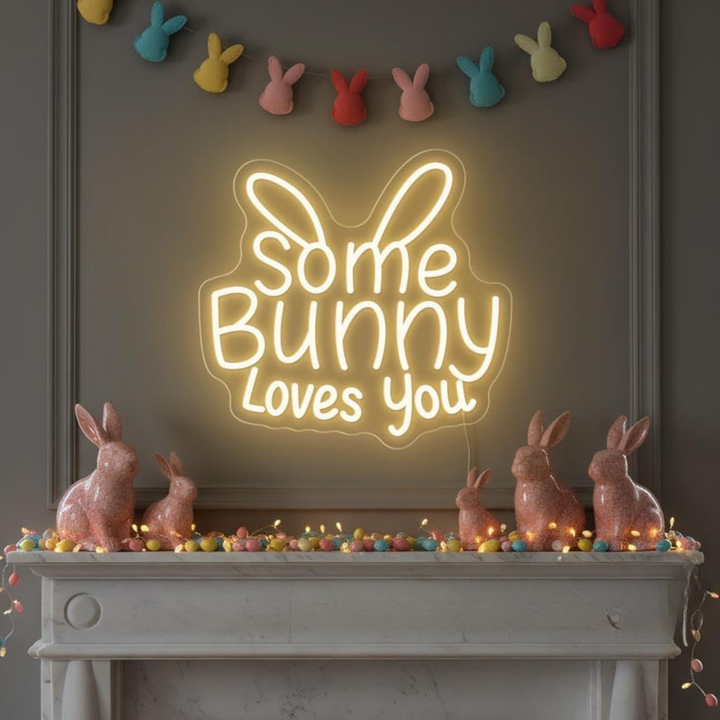 Some Bunny Loves You Easter LED neon sign glowing on wall with cute bunny themed design for Easter party setup by Neon.Shop.