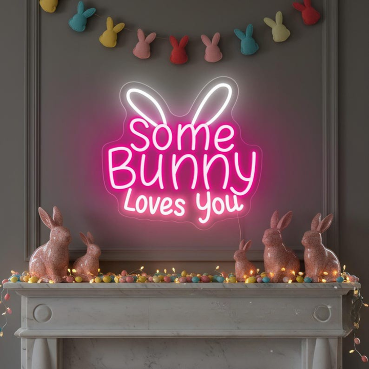 Some Bunny Loves You Easter LED neon sign glowing on wall with cute bunny themed design for Easter party setup by Neon.Shop.