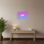 Sorry We Are Closed Business Neon Sign by Neon.Shop glowing above a shop entrance, letting customers know the business is closed
