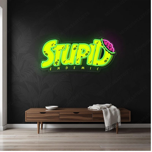 Stupid Endemic UV printed LED neon sign by Neon.Shop glowing on a wall as bold and edgy modern neon décor