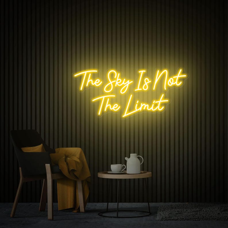 The Sky Is Not The Limit” inspirational LED neon wall light, perfect for creative spaces, gyms, and home workspaces by Neon.Shop.