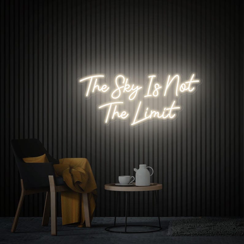 The Sky Is Not The Limit” inspirational LED neon wall light, perfect for creative spaces, gyms, and home workspaces by Neon.Shop.
