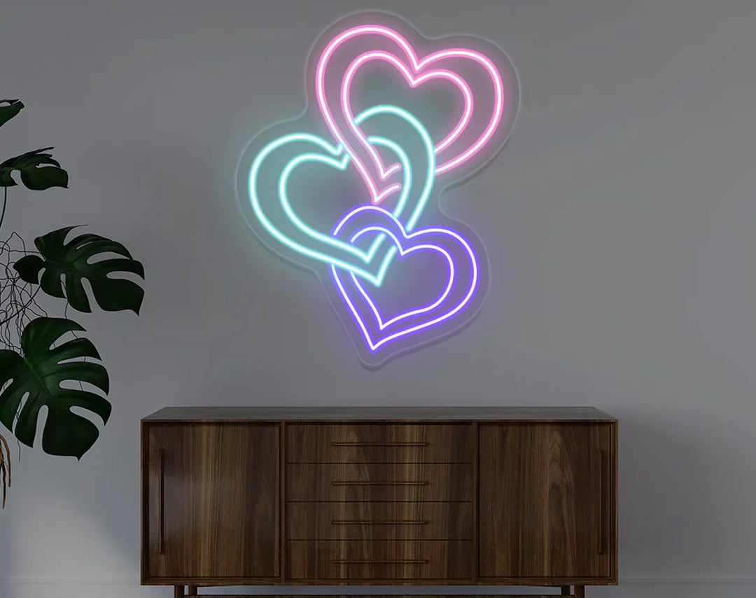 Three Hearts Love Valentine's Day Neon Sign by manhattanneons.com – Celebrate love with this triple heart neon sign.