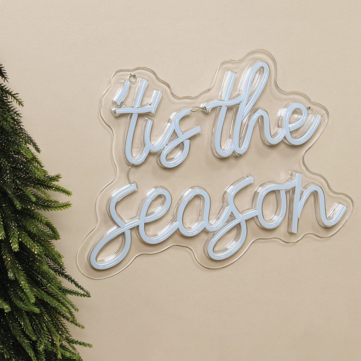 Tis The Season Merry Christmas Neon Sign by Neon.Shop glowing in LED light with festive lettering design.